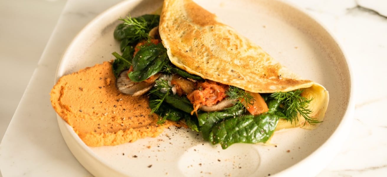 A picture of a delicious cheese omelette with spinach